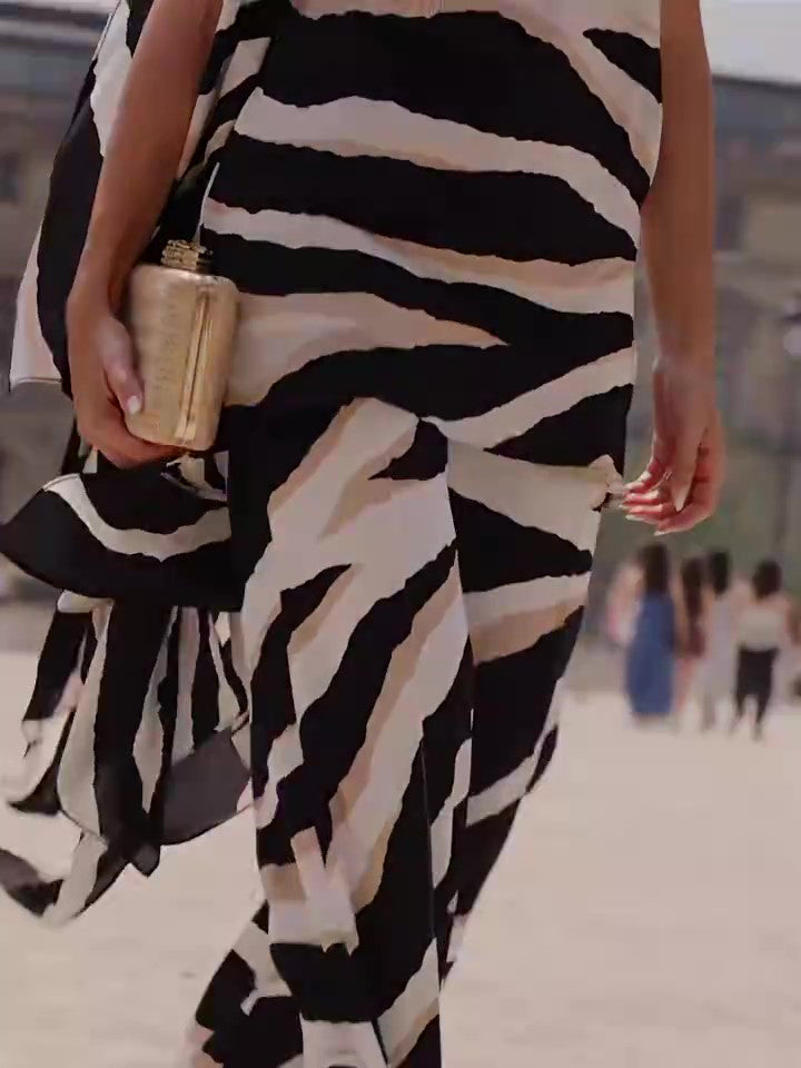 Look sofisticado animal print de corte asimétrico